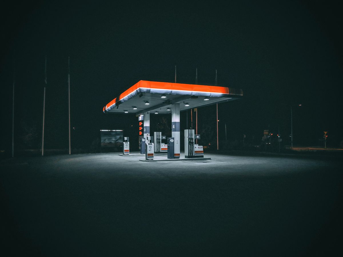 A filling station forecourt at night
