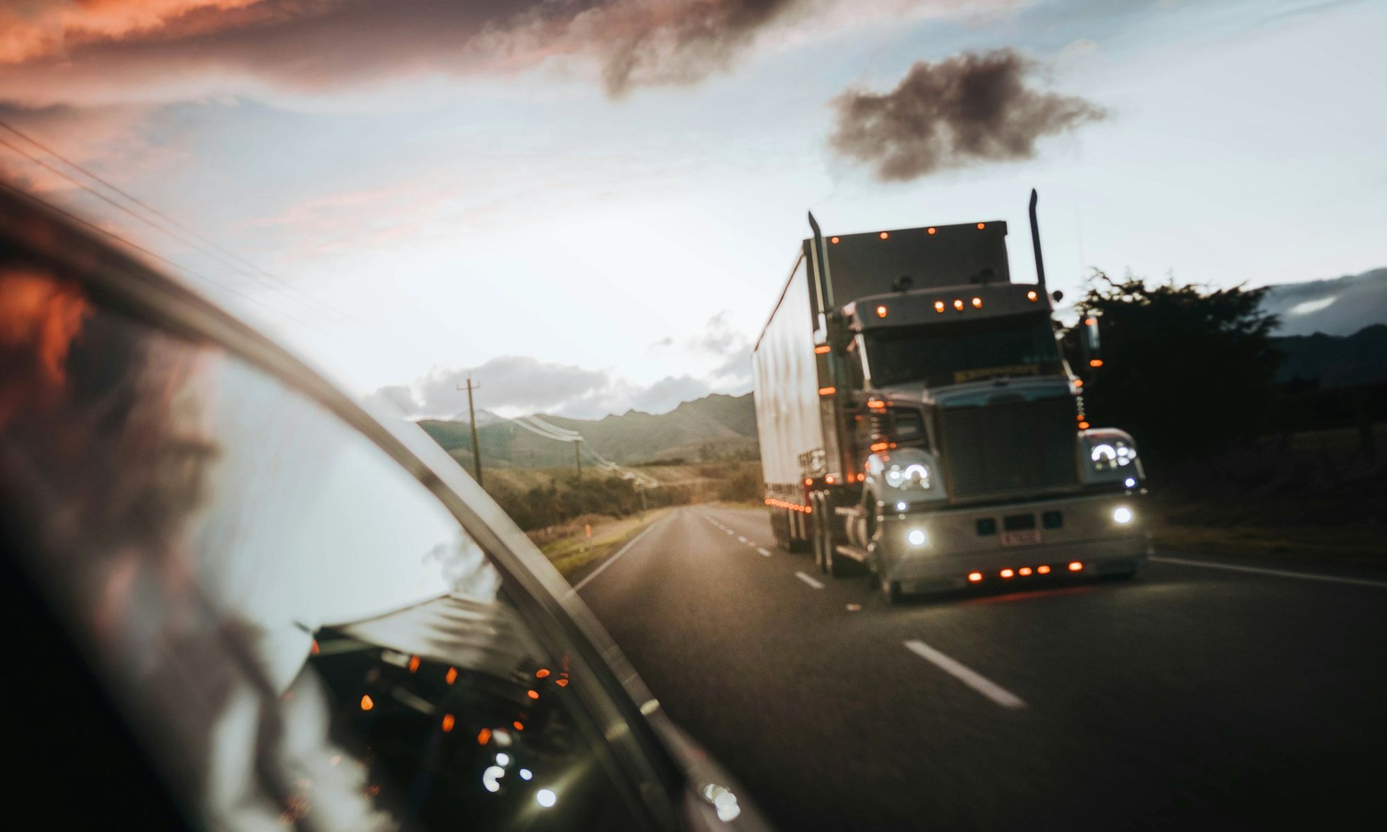 Heavy truck travelling at dusk